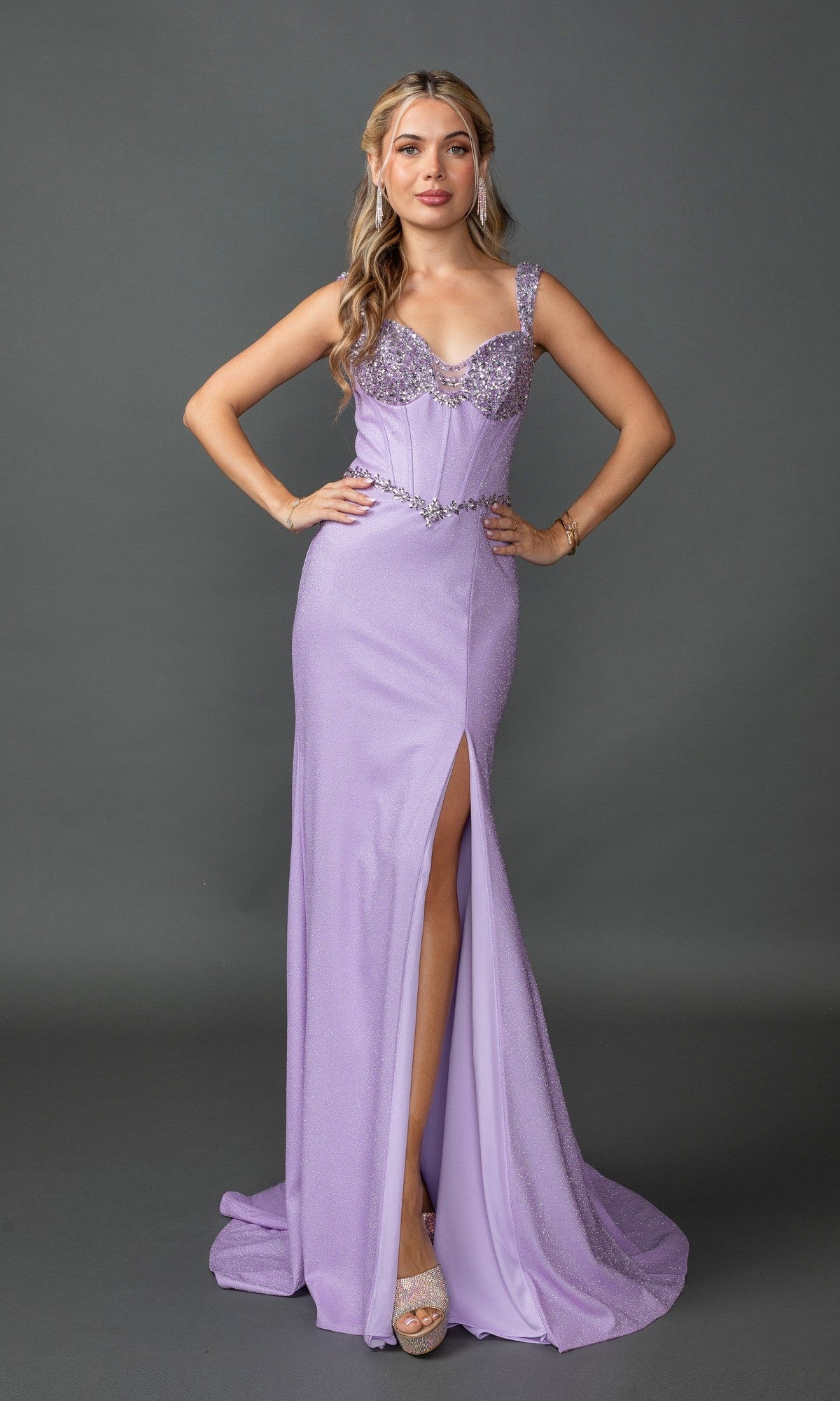 A woman models the Beaded-Bust Lace-Up Long Prom Dress in lilac, featuring beaded details and a thigh-high slit, paired with heeled sandals against a plain gray background.